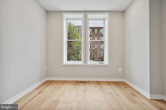 unfurnished room featuring light hardwood / wood-style floors