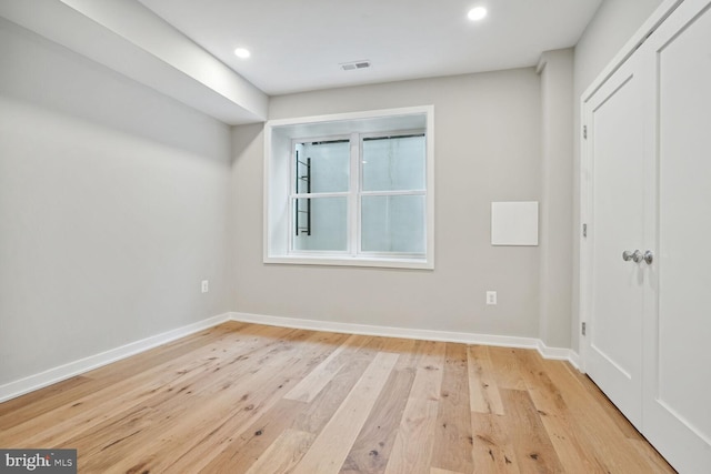 unfurnished bedroom with light wood-type flooring