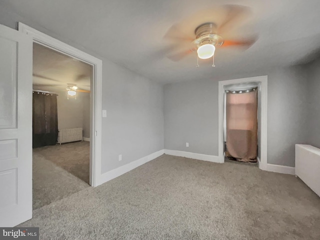 unfurnished bedroom featuring ceiling fan, radiator heating unit, and light carpet