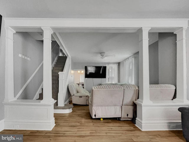 living room with ceiling fan and light hardwood / wood-style floors