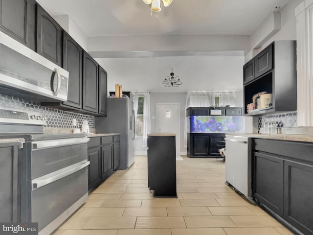 kitchen featuring appliances with stainless steel finishes and backsplash