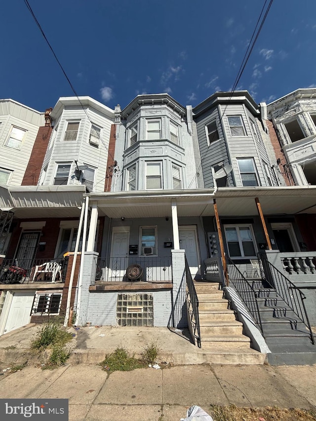 townhome / multi-family property with covered porch