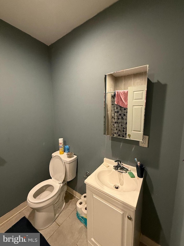 bathroom with toilet, tile patterned flooring, vanity, and a shower with shower curtain