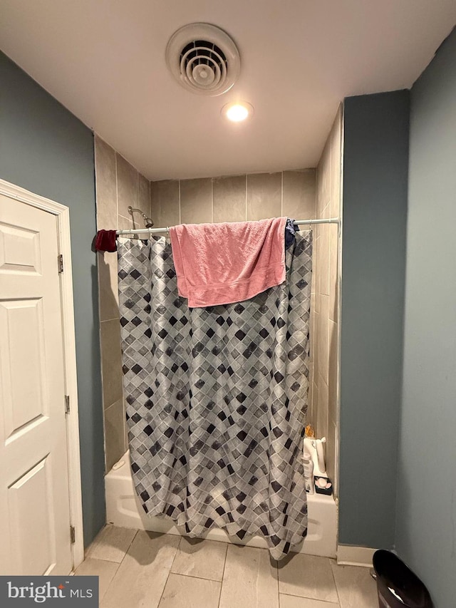 bathroom featuring shower / tub combo and tile patterned floors