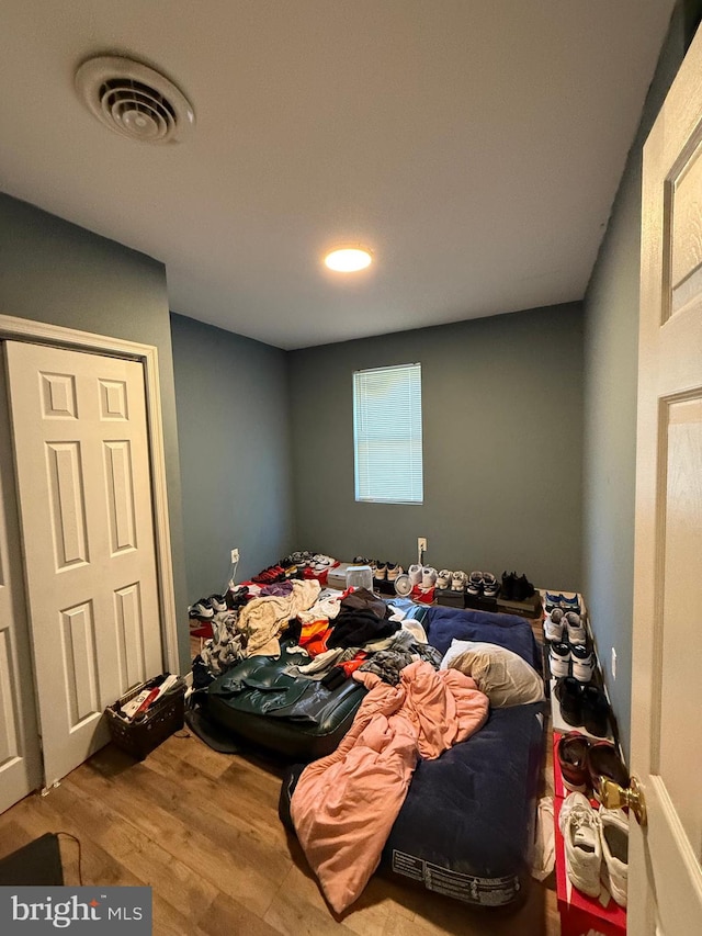 bedroom with hardwood / wood-style floors