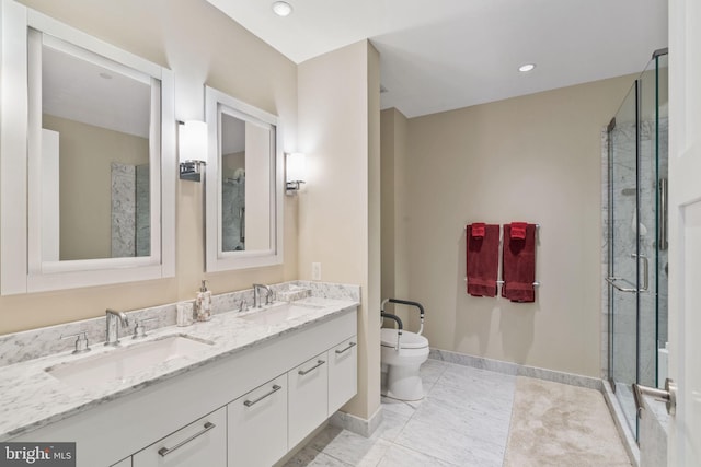 bathroom with a shower with door, vanity, and toilet