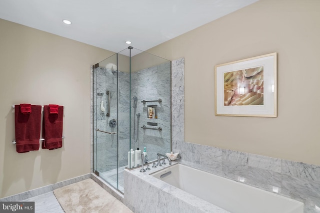 bathroom featuring separate shower and tub