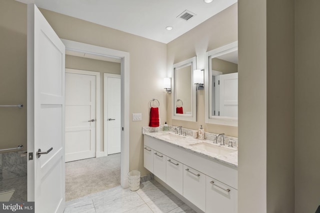 bathroom with tile patterned flooring and vanity