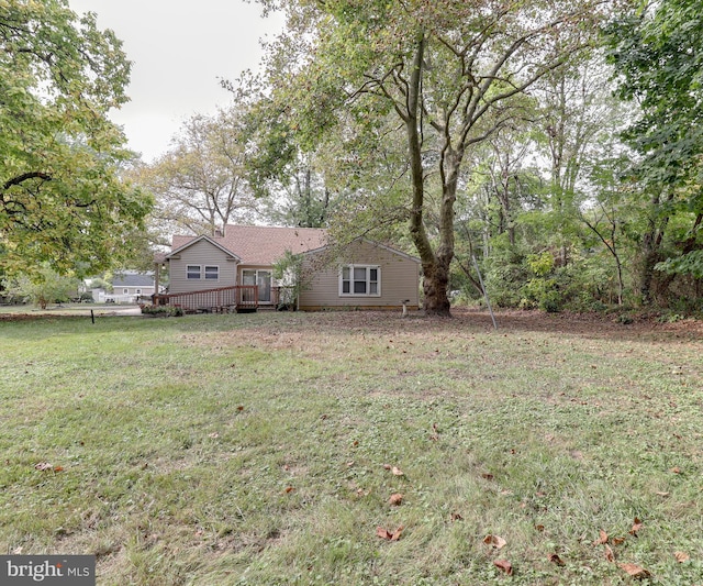 view of yard with a wooden deck