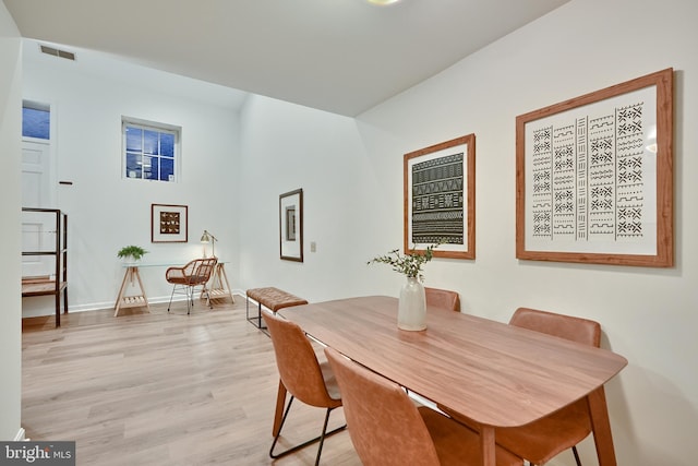 dining area with light hardwood / wood-style flooring