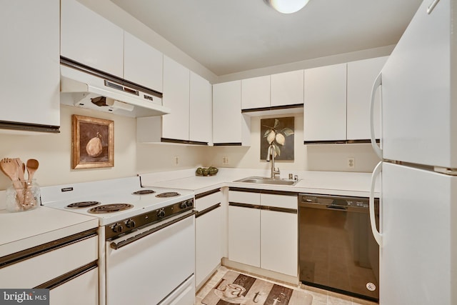 kitchen with white appliances, sink, and white cabinets