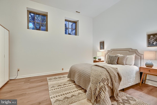 bedroom with hardwood / wood-style floors