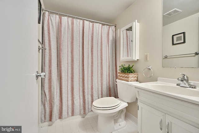 bathroom with a shower with curtain, vanity, tile patterned flooring, and toilet