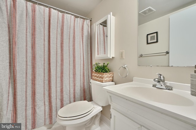 bathroom with tile patterned floors, a shower with curtain, vanity, and toilet