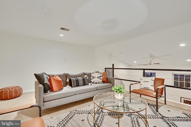 living room with light carpet and ceiling fan