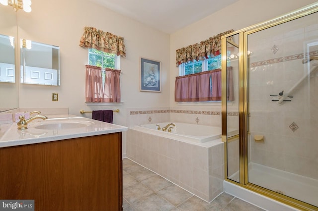 bathroom featuring tile patterned floors, vanity, and plus walk in shower