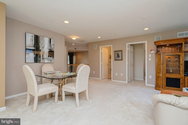 view of carpeted dining space