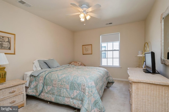 bedroom featuring ceiling fan and light carpet