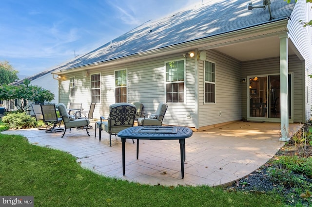 back of property featuring a patio area