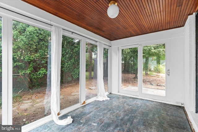 unfurnished sunroom with wood ceiling