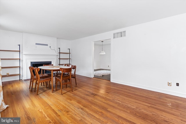 dining space featuring hardwood / wood-style floors