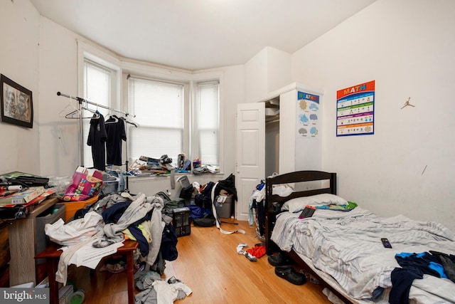 bedroom with hardwood / wood-style floors