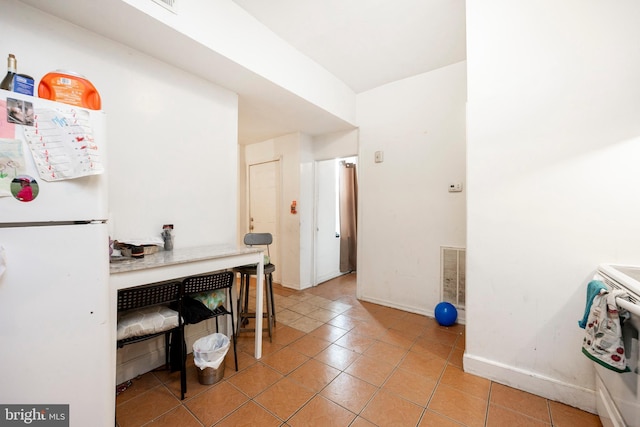 interior space featuring light tile patterned floors