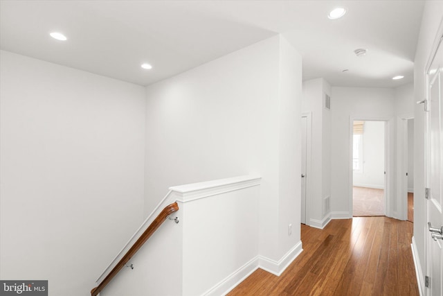 corridor featuring hardwood / wood-style floors