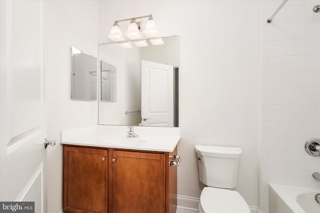 full bathroom featuring tiled shower / bath combo, vanity, and toilet