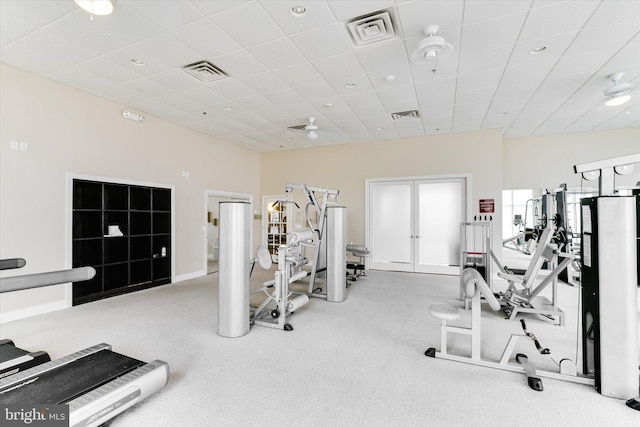 workout area with carpet flooring and ceiling fan