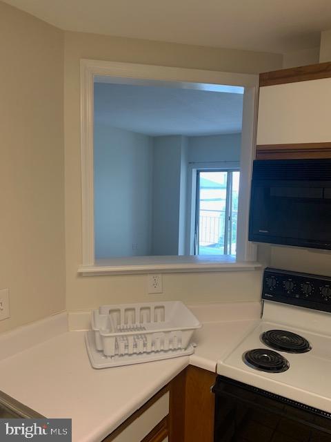 kitchen featuring white electric stove