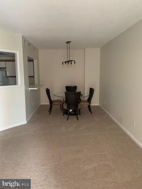 unfurnished dining area with carpet flooring