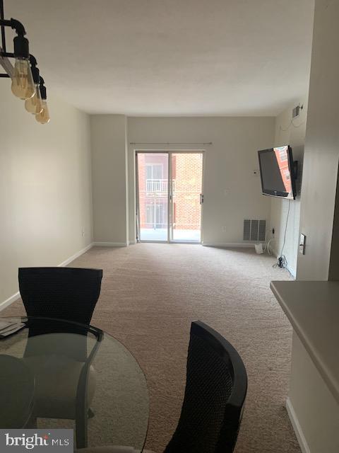 living room featuring light carpet