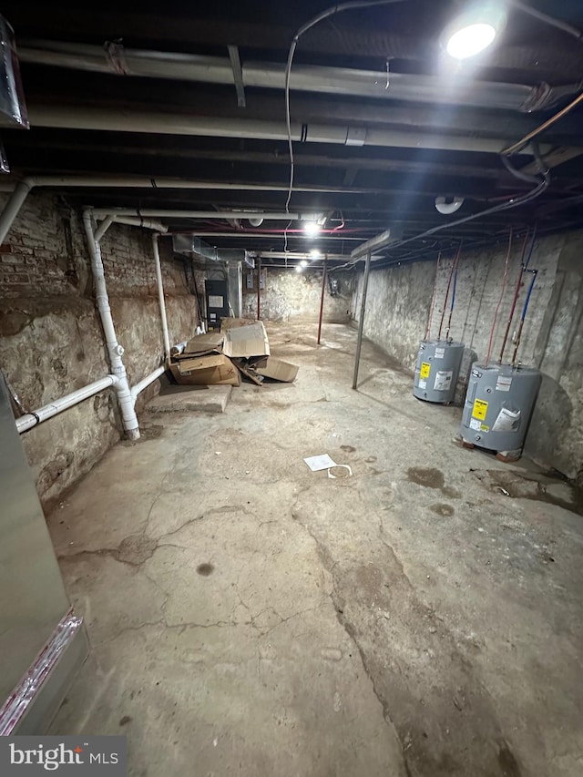 basement featuring electric water heater and electric panel