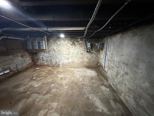 basement featuring electric panel