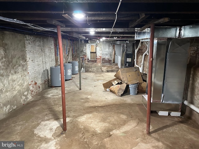 basement featuring water heater