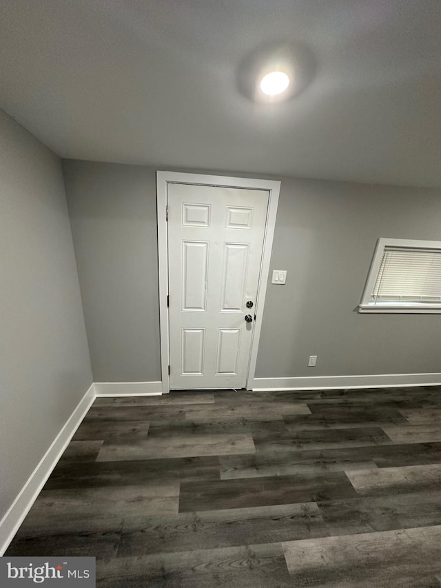 entrance foyer with dark hardwood / wood-style floors