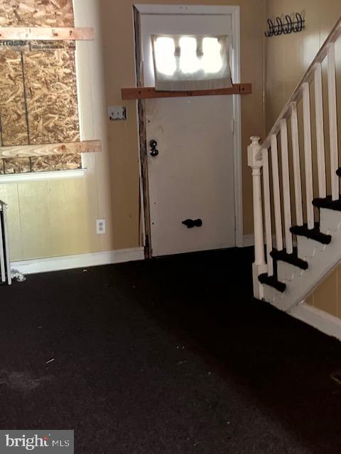 entryway featuring radiator heating unit