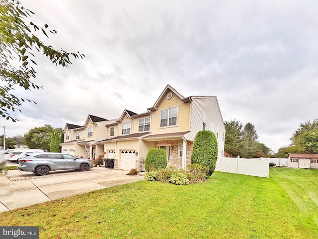 107 Sequoia Dr, Berlin, NJ 08009 - townhome / multi-family property featuring stone siding, an attached garage, and concrete driveway