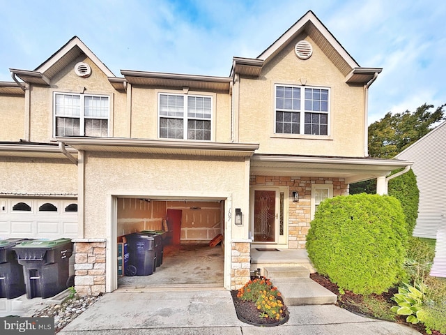 107 Sequoia Dr, Berlin, NJ 08009 - multi unit property featuring driveway, stone siding, a garage, and stucco siding
