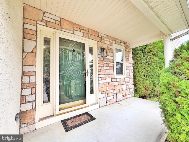 107 Sequoia Dr, Berlin, NJ 08009 - doorway to property featuring stone siding and covered porch