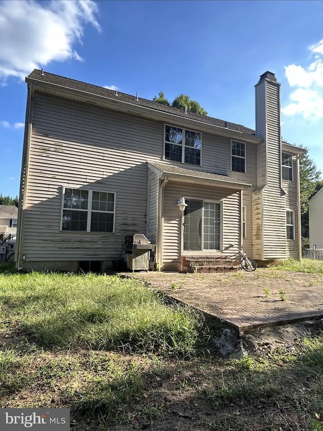 back of house featuring a patio area