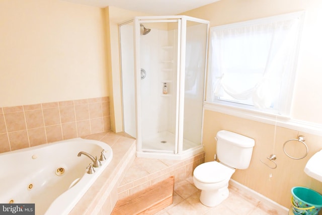 bathroom featuring tile patterned floors, separate shower and tub, and toilet