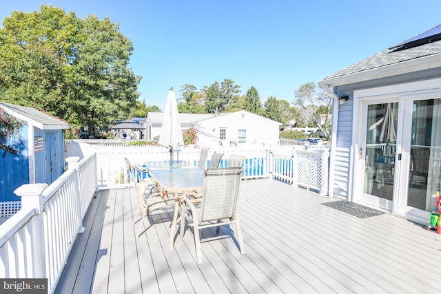 deck featuring a storage shed