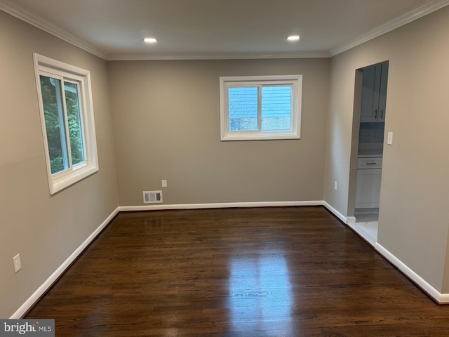 unfurnished room with crown molding and dark hardwood / wood-style flooring