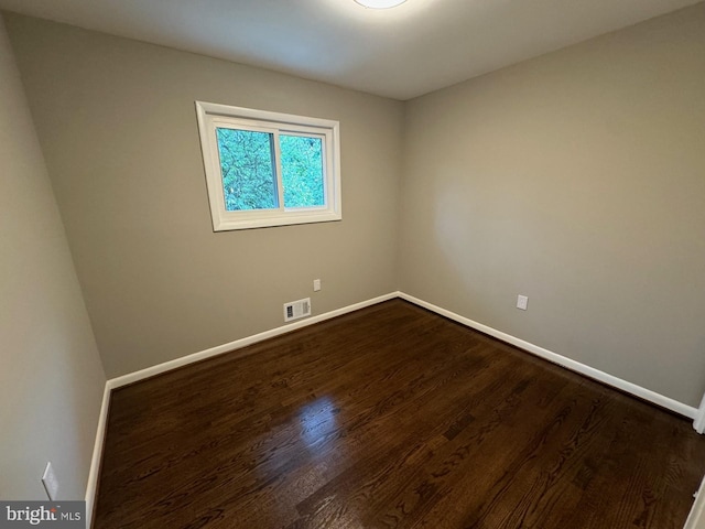 spare room featuring hardwood / wood-style floors