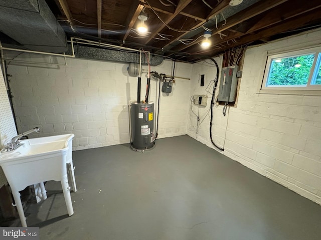 basement featuring electric panel and water heater