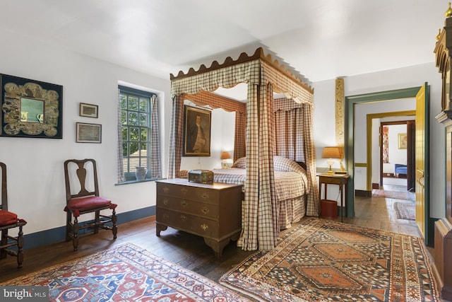 bedroom featuring dark hardwood / wood-style flooring