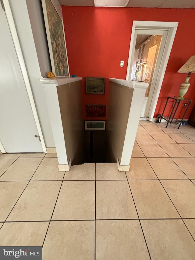 interior space featuring light tile patterned floors