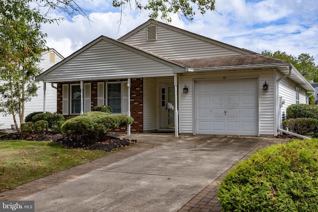 view of front of home with a garage and a porch